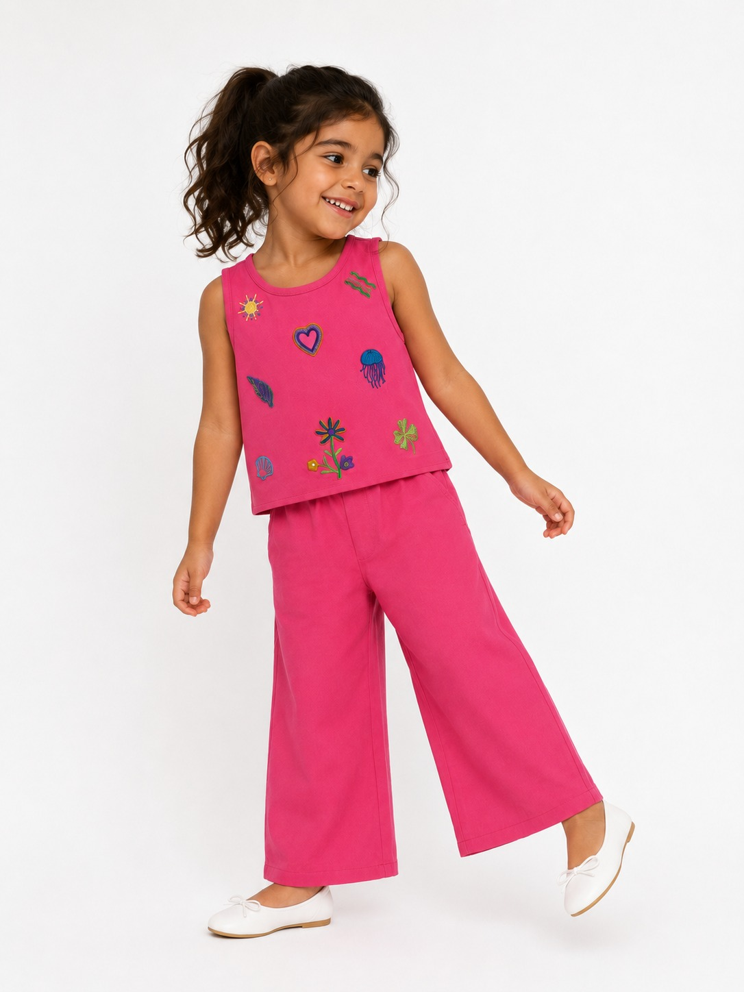 Bright pink sleeveless top and wide-leg pants set