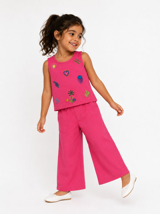 Bright pink sleeveless top and wide-leg pants set